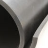 Close-up of the edge of a Commercial Neoprene Rubber Sheet in dark grey, highlighting its thickness and smooth surface texture.