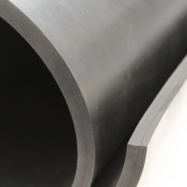 Close-up of the edge of a Commercial Neoprene Rubber Sheet in dark grey, highlighting its thickness and smooth surface texture.