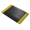 The Premium Anti-Fatigue Mat is a rectangular black floor mat featuring a diamond plate texture and wide yellow safety borders on two opposite edges.
