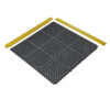 The Nitrile Top Interlocking Mat is a black, square anti-fatigue floor mat with circular holes and interlocking edges, shown with two yellow bevelled edge pieces aligned along the top and left sides.