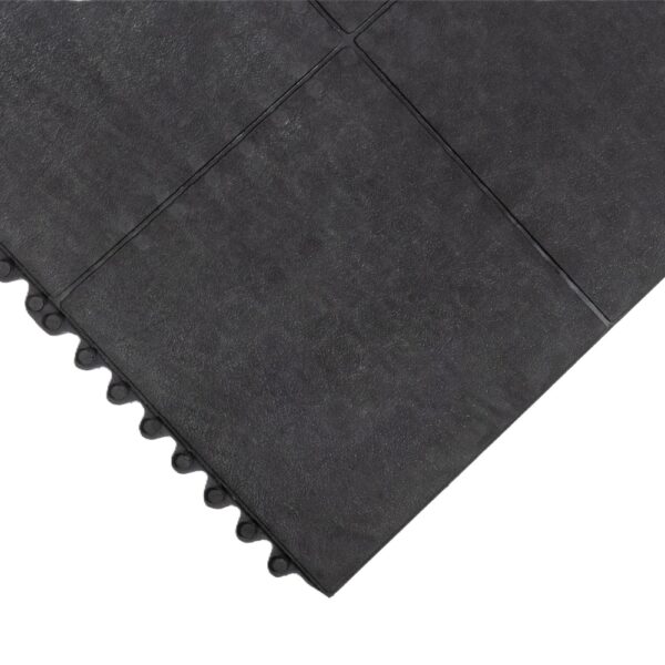A close-up view of the Solid Top Interlocking Mat, highlighting its black textured surface and interlocking edges.