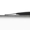 A serrated black knife blade is shown in close-up, positioned horizontally and partially cutting into the surface of a Diamond Welding Mat in light grey against a white background.