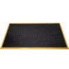 The Heavy-Duty Workstation Mat is a rectangular black rubber mat with a diamond-textured pattern and yellow-bordered edges.