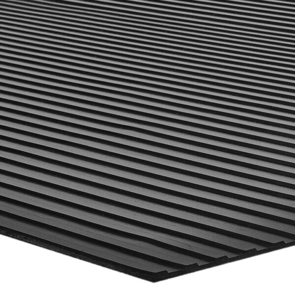 A close-up, low-angle view of the Wide Ribbed Rubber Matting in black, featuring evenly spaced parallel ridges running across its surface.